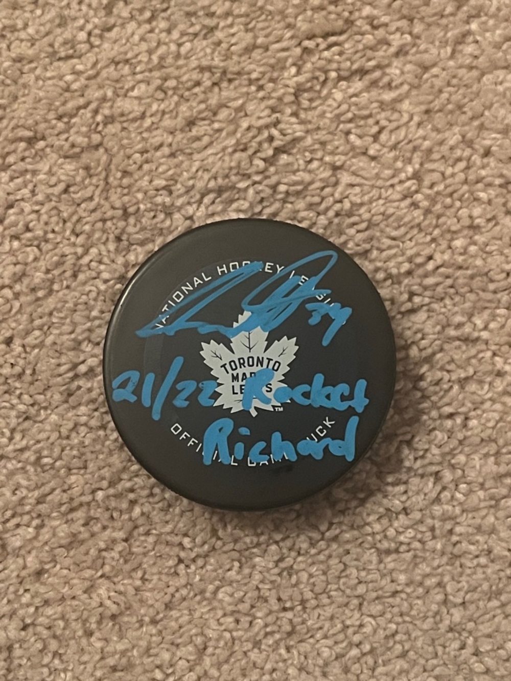 Toronto Maple Leafs Autographed Austin MatthewHockey Puck in Black with Blue Ink